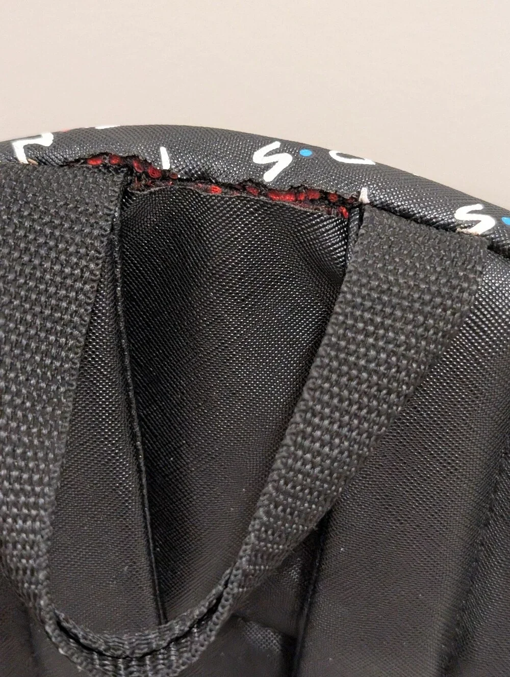 Friends Backpack all over print. need small repair see zoomed in photo